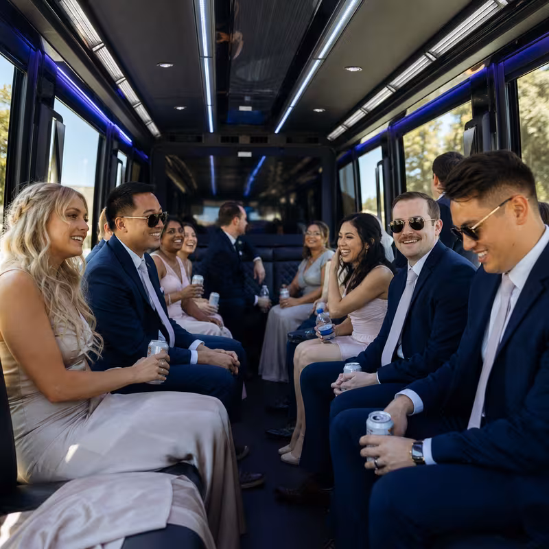Wedding guests seated inside a Phoenix party bus