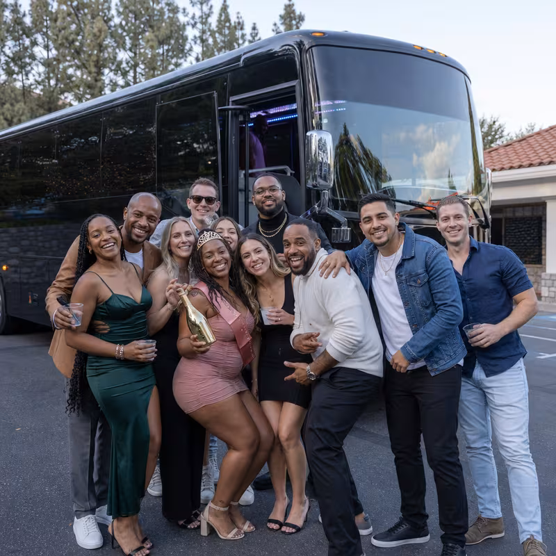 Party bus interior with wraparound leather seating and LED lighting in Phoenix