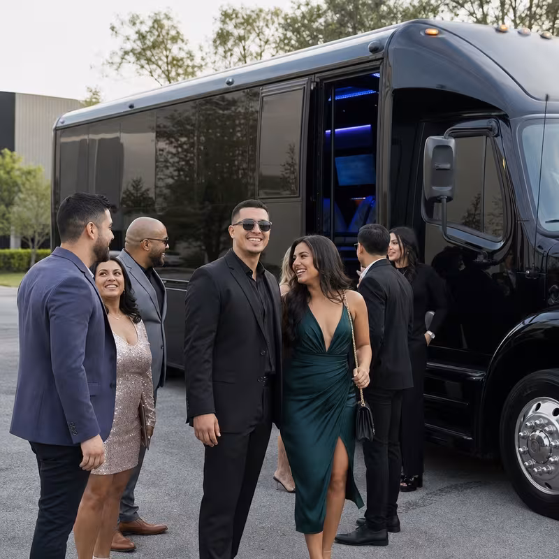 Passengers loading luggage while boarding an Phoenix group shuttle