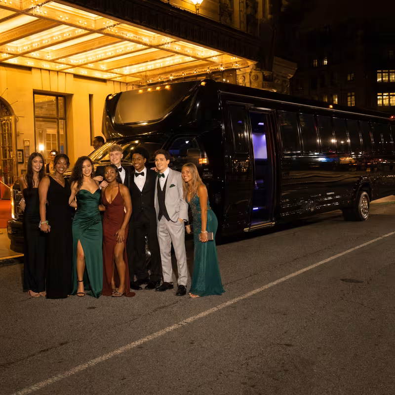Party bus interior with wraparound leather seating and LED lighting in Phoenix