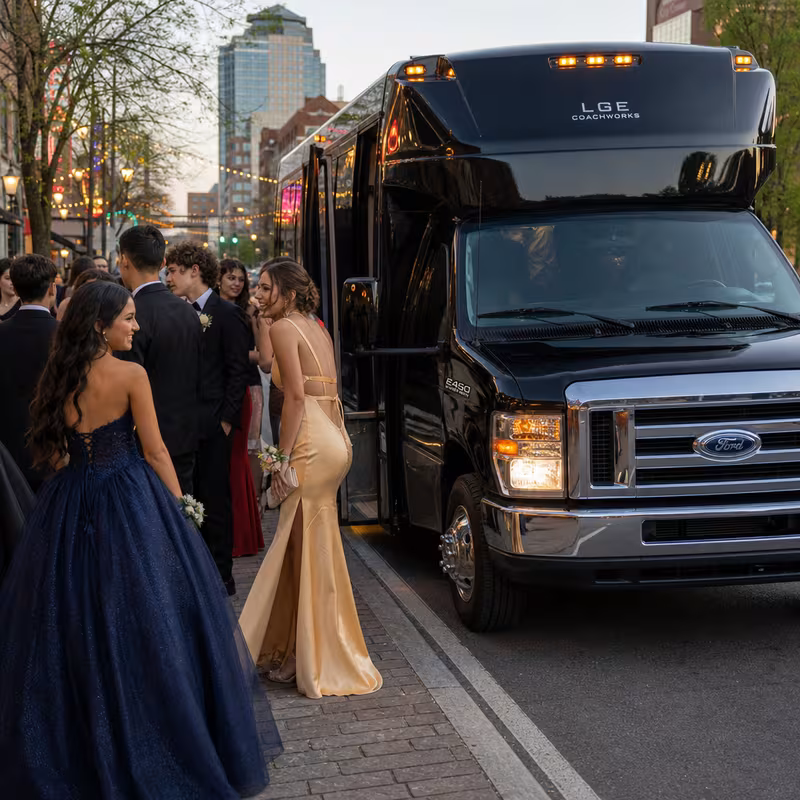 Passengers loading luggage while boarding an Phoenix group shuttle