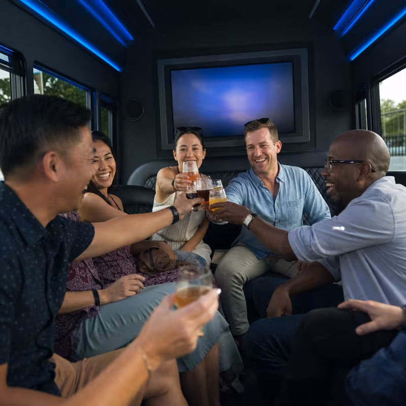 Group boarding a white charter bus for Winery & Brewery Tour Transportation transportation in Phoenix