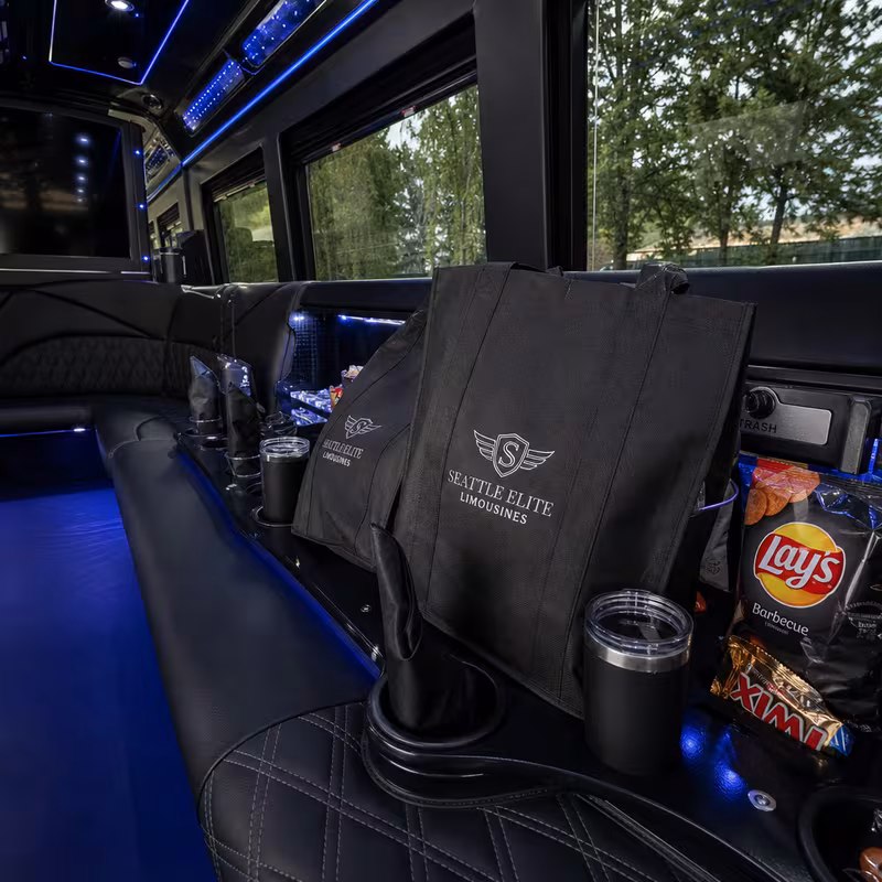 Party bus interior with wraparound leather seating and LED lighting in Phoenix